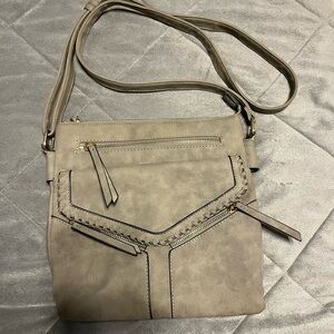 Maurices Tan Crossbody Bag with Adjustable Strap and Distinctive Design